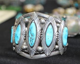 Navajo cuff with quality turquoise stones signed