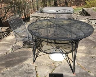 46” round wrought iron table and two chairs $125