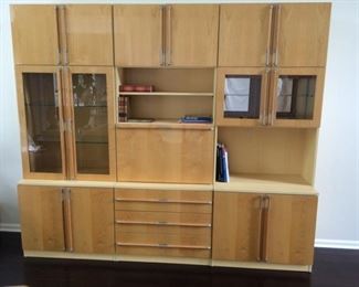 Oak Veneer Wall Unit European Import   $1500
The total size is 86” high (bottom section 28”, top section 58”), 100.5” wide. There are 3 sections, each 86” high and 33.5” wide, so you could have 3 separate bookcases but I think it looks good as one unit. The depth of the bottom section is 19” and the depth of the top section is 15”.