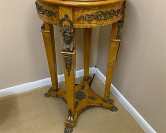Antique Reproduction Burl Wood Stand with Black Marble Top and Bronze Details.  $2,000