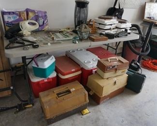 Tackle boxes, coolers, bike rack lower left, shop vac, extension cords