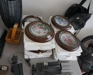 collection of hummingbird plates with papers