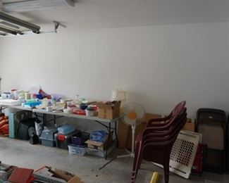 Assorted plastic ware and Tupperware, stackable lawn/deck chairs, folding chairs, doggie gate