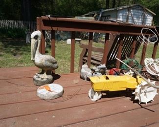 Assorted garden decorations, Neilson tractor yard sprinkler.