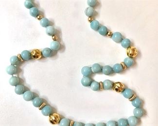 $50 Blue stone beaded necklace with gold accents and character clasp 