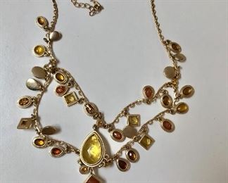 $25 Multi strand topazzy gold tone necklace 