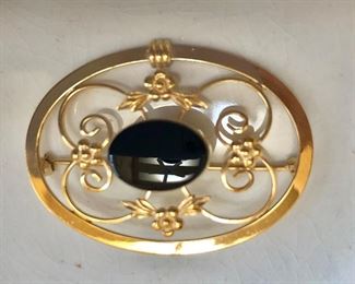$20 Gold fill filigree pin with black onyx color stone center.  1.8"L; 1.3"W 