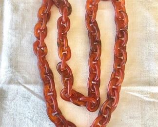 $45 Early plastic art deco burnt orange hoop necklace 30" L 