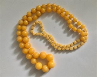 $85  Yellow stone graduated  individually knotted beaded necklace  33" long 