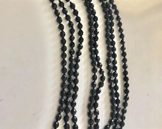 $75 All or $25 each super long  black flapper necklace.  3 necklaces attached total 84" long.  Each necklace is 28" long 