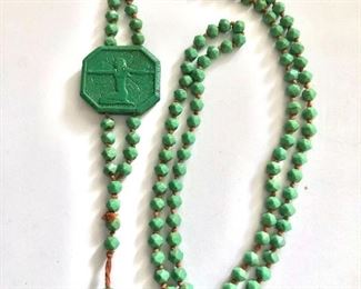 $100 Egyptian revival green carved medallion and individually knotted beaded  necklace.  Necklace: 32"L.  Pendant: 5"L