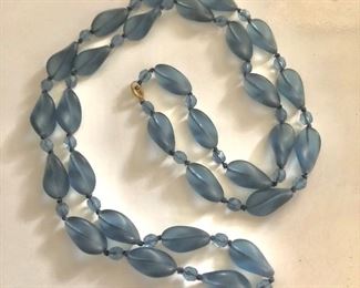 $35 Polished glass lilac blue necklace.  36"L 