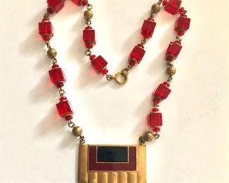 $35 Art deco medallion necklace.  Necklace: 17"L. 
 Pendant: 1.3"L