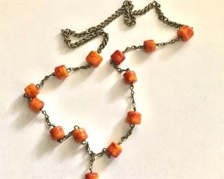 $35 Orangey red necklace with pendant drop.  29"L