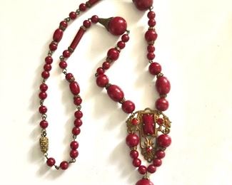 $60 Art deco red beaded medallion with drop necklace.  16"L and pendant: 2"L 