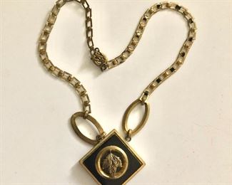 $20 Art deco necklace with leaf medallion center.  16"L 