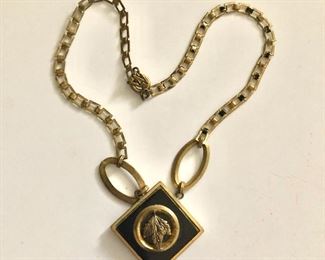 $20 Art deco necklace with leaf medallion center. 16"L
