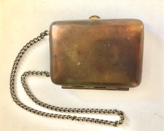 $35 Coin holder plus (very solid) marked German silver.  Case: 3.2"x2.4".  Chain: 15"L
