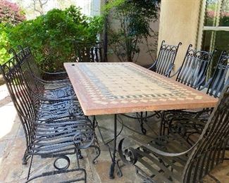 Frontgate tile top outdoor dining table and 6 wrought iron rocker chairs