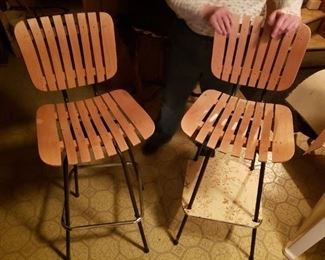 (2) Vintage Solid Wood Slatted Bar Chairs with foot rests  the height of the stools from floor to seat on the  Sides of the chair Is 30" but as it sweeps in towards the center it looks like it's around 28".         $150  for pair