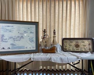 Nautical Group
Large print of Virgin Islands sailor rope shadow box, pirate ship carved of wood, and two lighthouses