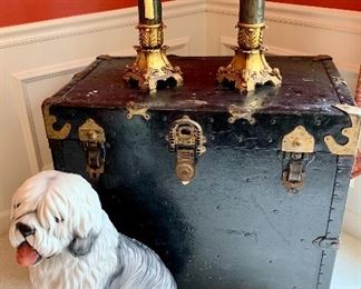 $200 - Herbert and Meissen Black Trunk with Brass Accents and Leather Handles - 32l x 19.5w x 27h.  $200 - Hand Painted Italian Porcelain Dog. $60 - Pair of Gold Candle Holders - 15.5h
