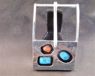 Unmarked sterling with turquoise and Coral belt buckle.