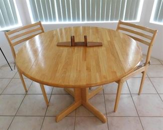 Kitchen table with fold down sides and two chairs