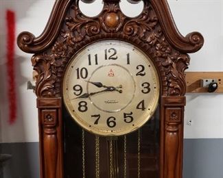 Westminster quartz faux wood battery-powered Grandfather clock works Approximately 76 1/2 inches tall by 23 3/4 inches wide by 11.25" deep. Clock itself is 19 1/2 inches wide By 8" deep.     $295