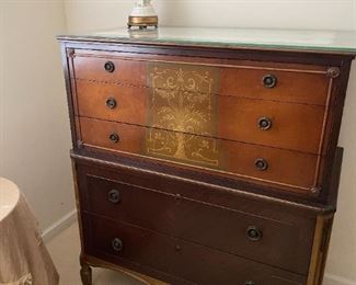 . . . this is a 1930's dresser in walnut with inlaid center