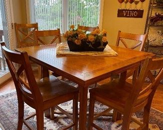 Solid wood table purchased from Missouri furniture. Table opens up to seat six.