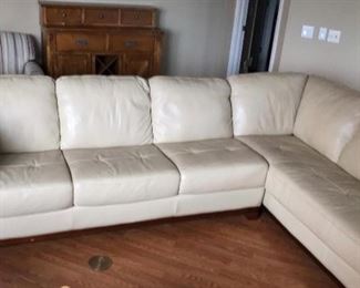 100% full leather sectional. Only four years old. Color shows it to be white but it is actually a beige color. Very , VERY nice piece of furniture!