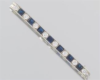 Ladies J. E. Caldwell  Co. Edwardian Platinum, Blue Sapphire and Diamond Bar Pin