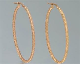 Ladies Pair of Oval Diamond Cut Earrings 