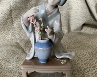 #9 Lladro “Geisha Arranging Flowers” 4840, a geisha, kneeling, tending to an ikebana garden—$124 
