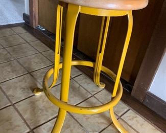 Vintage yellow metal stool with wooden top