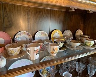 many cups and saucers