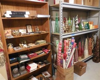 Misc items on book shelf; Christmas tree collection on metal shelf