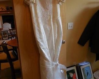 Beautiful larger size wedding dress (we put train in plastic bag to keep it off floor)