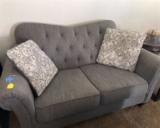 really nice tufted gray loveseat.  This is very comfortable!  