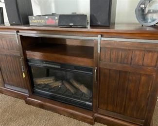 Fireplace/entertainment center with storage.  Come take a look at this! It's a beautiful piece!