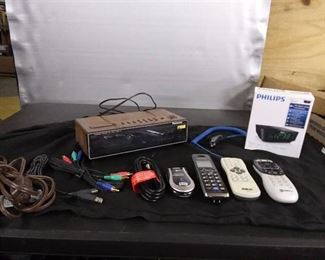 New Philips Alarm/ Vintage Panasonic Alarm/ 1 Direct TV Remote/ 1 RCA Remote/ Phone Charger/ AT&T Phone/ Panasonic Phone/ Other Cords/ Cables