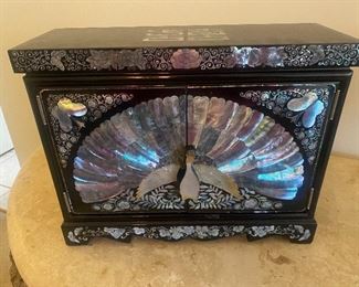 Black lacquer and abalone shell
16 inches wide 13 inches tall 6 inches deep $90.00