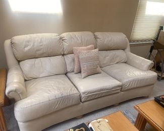 Off-white leather sofa has a few smudges $100