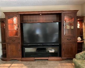 5 SECTIONED LIGHTED ENTERTAINMENT CENTER. PIECES CAN SEPARATE FOR EASY PLACEMENT.