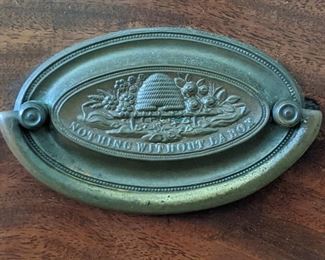 Close-up detail of the original brass pull "Nothing Without Labor" and God knows, those worker bees WORK!