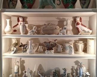 One of the display cabinets, with 16" tall cloisonne vases, hand-painted Nippon vases, celadon elephant, nice collection of Irish Belleek Porcelain (including some of the coveted first period black mark, 1863-1890) and a nice collection of Spanish Lladro porcelain figurines.