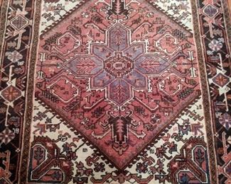 Vintage, hand-woven Persian Heriz rug, measuring 5' 6" x 6' 5".