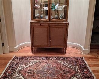 Vintage Theodore Alexander 2-piece mirrored glass. lighted china cabinet, with vintage Persian Heriz rug, measuring 5' 6" x 6' 5".