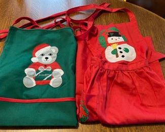 REDUCED!  $12.00 NOW, WAS  $16.00............................2 Christmas Aprons (B849)